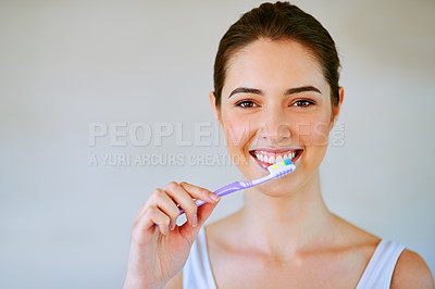 Buy stock photo Woman, toothbrush and toothpaste brushing teeth in bathroom for health, happiness and wellness in morning. Girl, portrait or cleaning mouth for healthcare, dental care and oral hygiene in home mockup