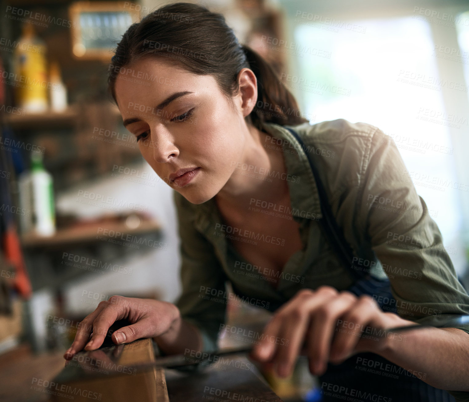 Buy stock photo Woman, carpenter and measuring with builders square for planning, wood working and vision in workshop. Female person, trade and gear for thinking with idea for furniture, manufacturing and production