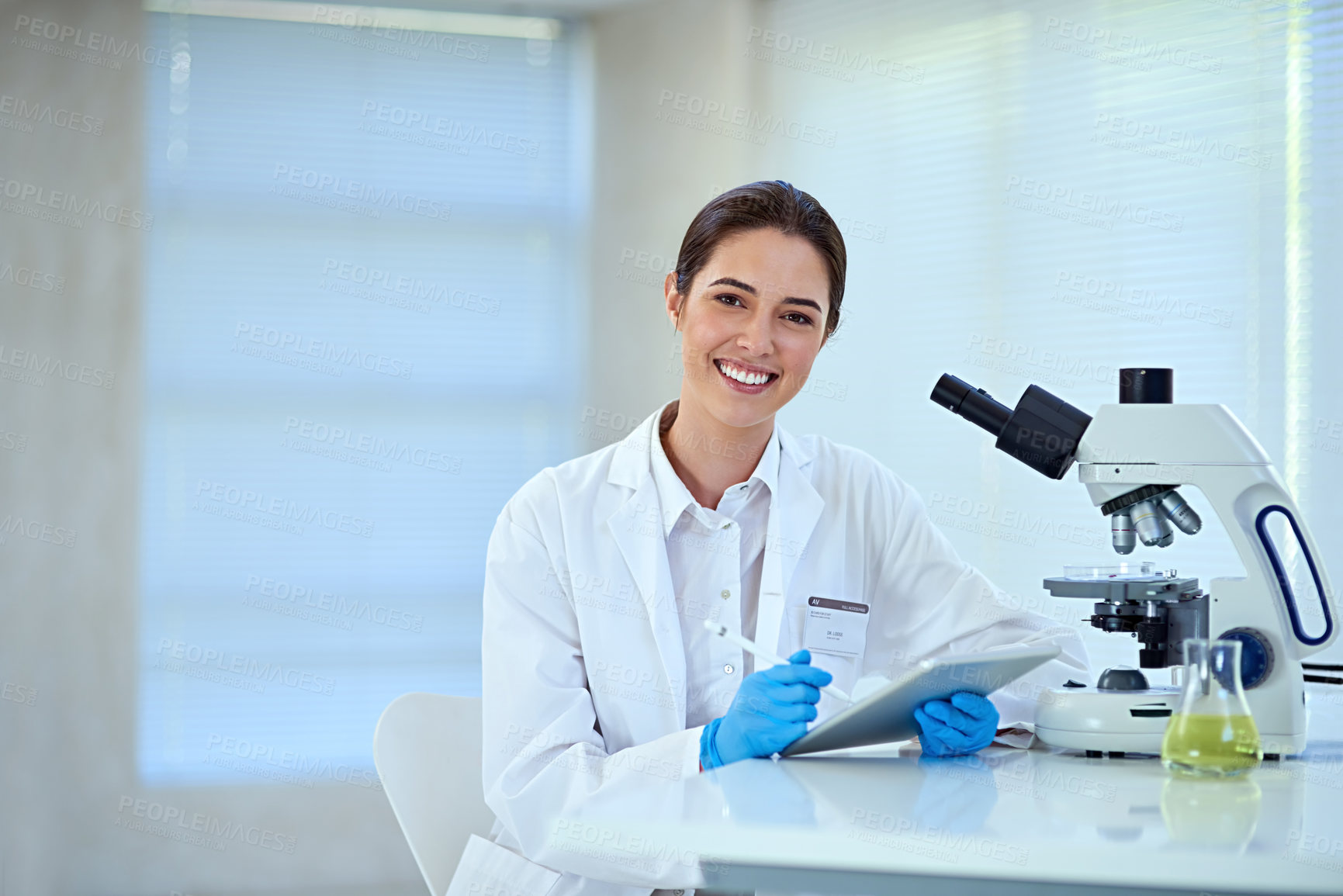 Buy stock photo Shot of a female scientist working alone in the lab