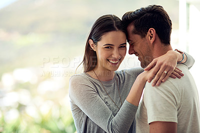 Buy stock photo Portrait of a happy young couple in a loving embrace