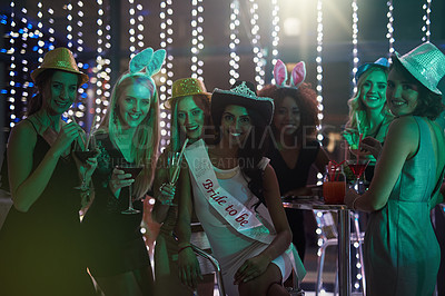 Buy stock photo Portrait of a group of young women having a bachelorette party at a nightclub