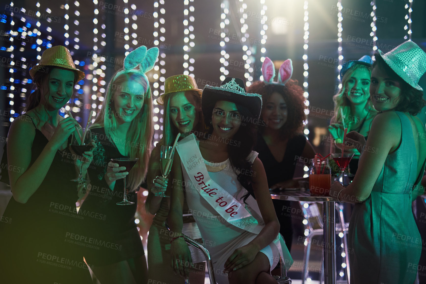 Buy stock photo Portrait of a group of young women having a bachelorette party at a nightclub