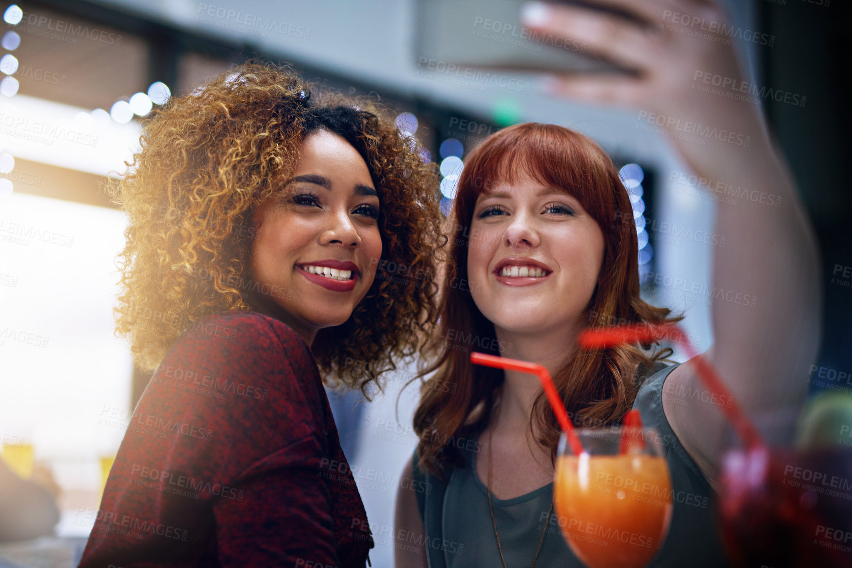 Buy stock photo Phone, selfie and friends with club cocktail for happy hour, wellness and bonding. Interracial, women and friendship gathering with smartphone photograph and alcohol drinks with smile.