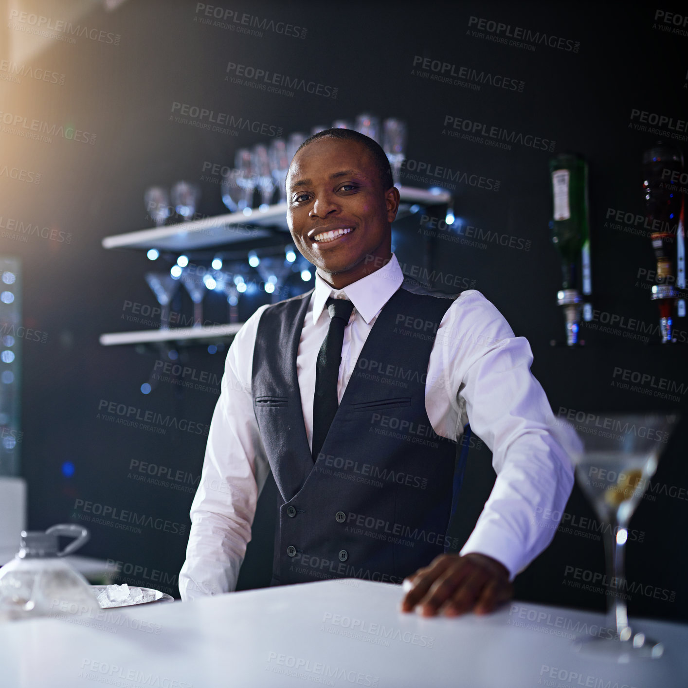 Buy stock photo Black man, bartender and confident portrait in restaurant, hospitality and counter server for alcohol. Male person, cocktail and martini at winery or hotel bar, waiter pride and barman selection