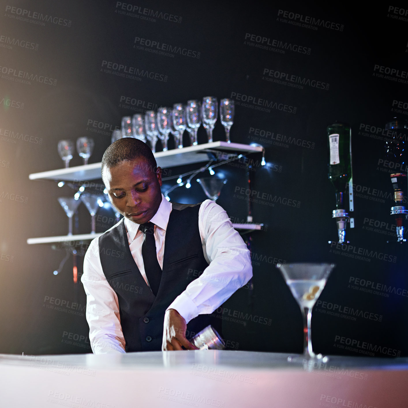 Buy stock photo Black man, bartender and mix drink in restaurant, hospitality and counter server for alcohol. Male person, prepare cocktail and martini at party or hotel bar, waiter confidence and barman selection