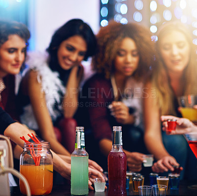 Buy stock photo Cropped shot of a group of friends having shots together at a party