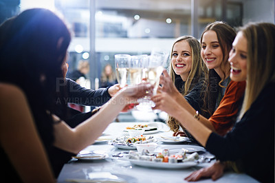 Buy stock photo Cropped shot of friends having a dinner party at a restaurant