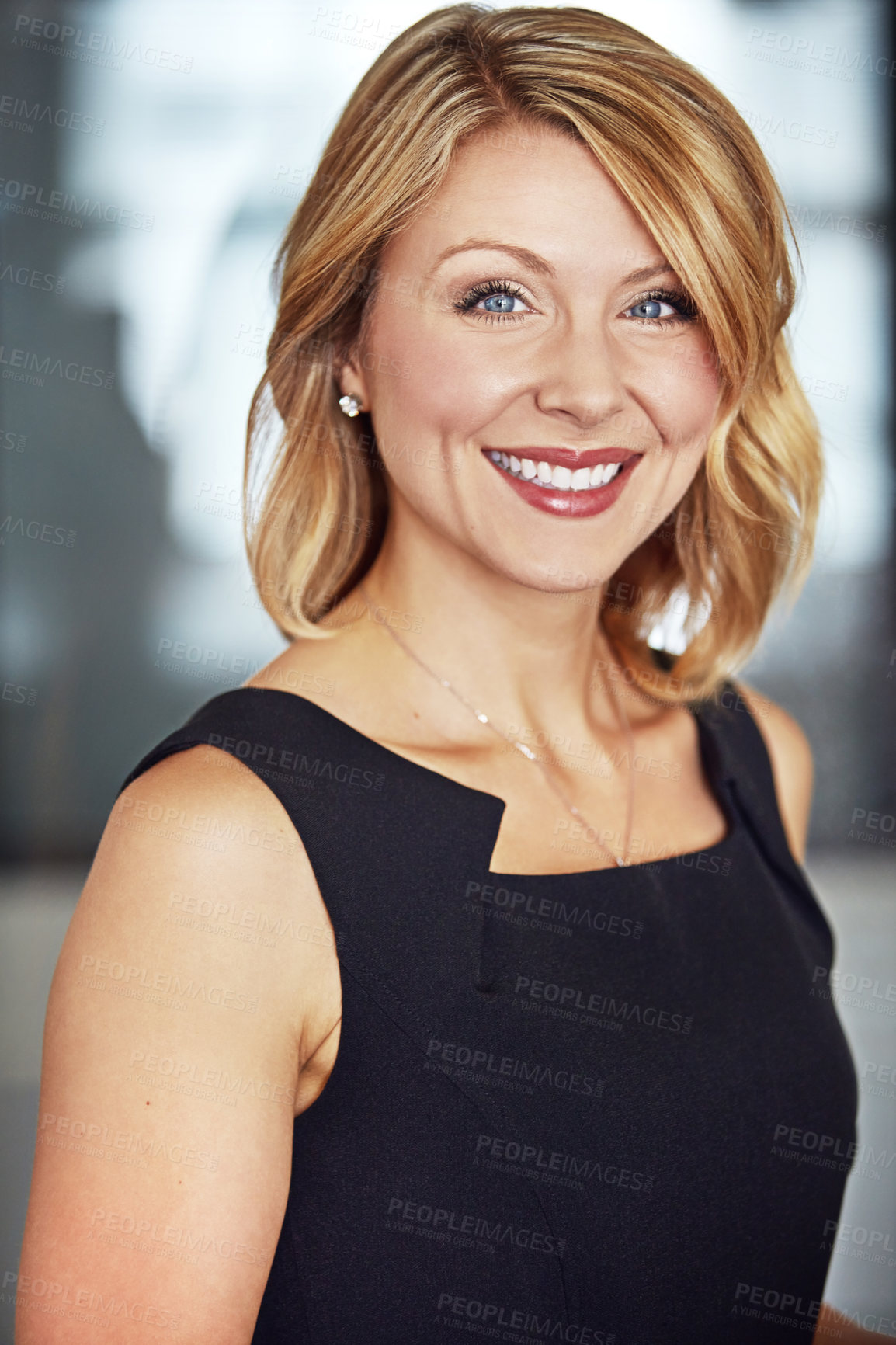 Buy stock photo Cropped portrait of a happy businesswoman in the office