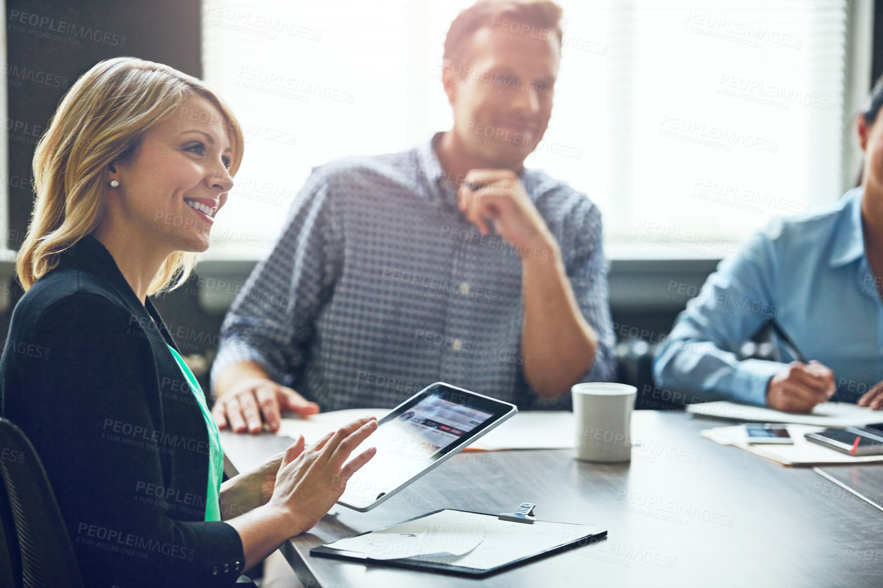 Buy stock photo Typing, notes and woman in meeting on tablet with research, app or online planner in office. Happy, discussion and tech for planning teamwork agenda, reminder or project manager with coworking idea