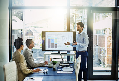 Buy stock photo Shot of a businessman giving a presentation in the boardroom