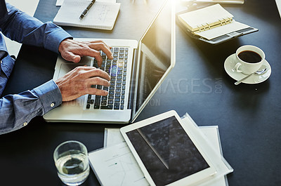 Buy stock photo Shot of an unrecognizable businessman working in his office