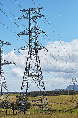 Buy stock photo Pylon, power lines and electricity for tower structure with steel of high voltage, energy and insulation cables for transmission. Grid, distribution and infrastructure for current, network and field