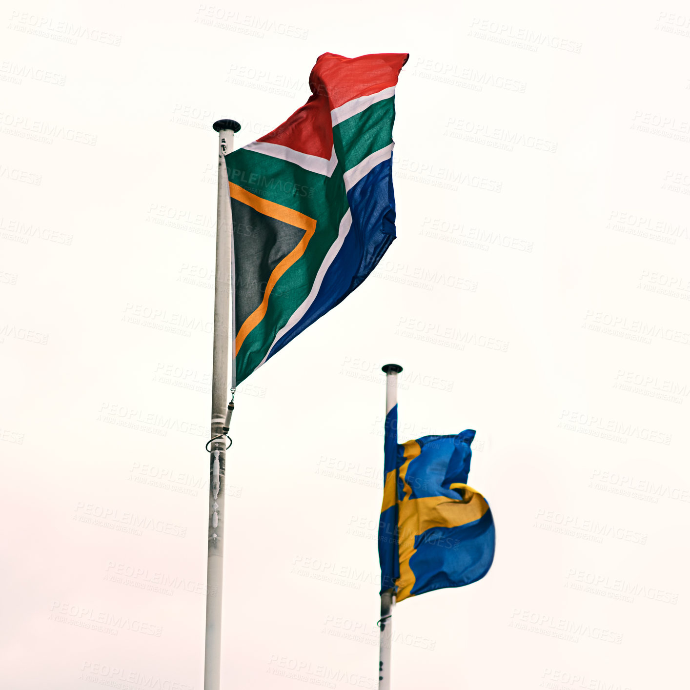 Buy stock photo South African and Swedish flags in wind for pride, diversity and collaboration with clear sky. Government, freedom and country alliance or embassy for unity and support with culture and heritage