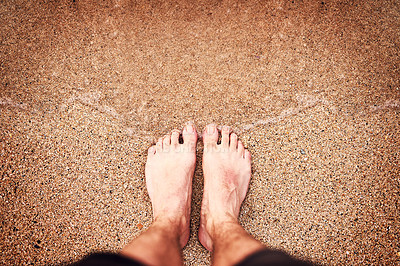 Buy stock photo High angle shot of an unrecognizable woman's feet at the beach