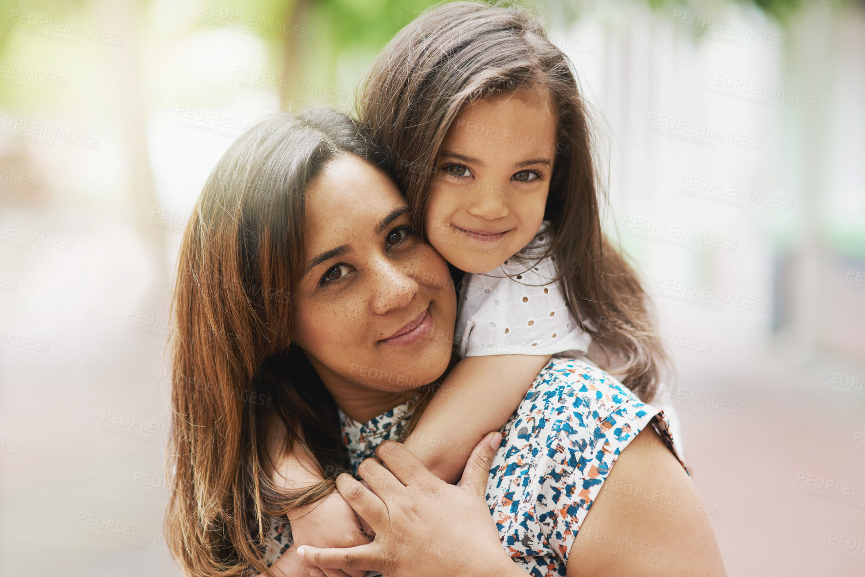 Buy stock photo Portrait of a mother and daughter bonding together outside