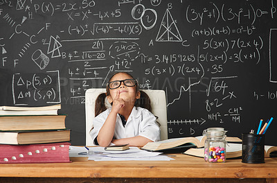 Buy stock photo Shot of an academically gifted young girl working in her classroom