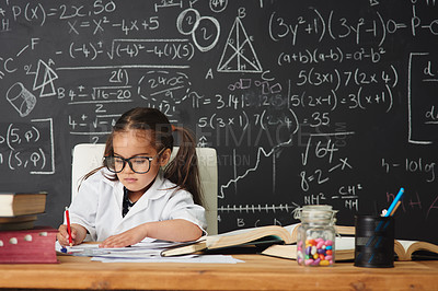 Buy stock photo Shot of an academically gifted young girl working in her classroom