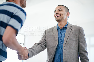 Buy stock photo Shot of a businessman shaking hands with an unrecognizable person