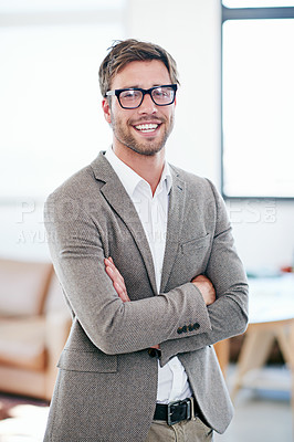 Buy stock photo Portrait of a handsome young businessman in his office