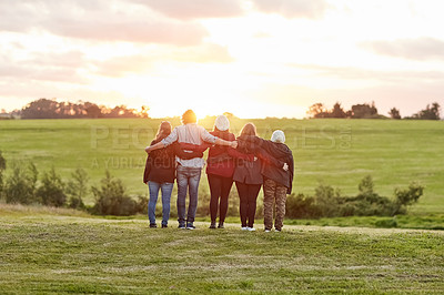 Buy stock photo Rearview shot of a group of friends admiring the view together on a weekend getaway