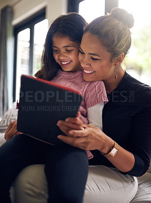 Buy stock photo Smile, girl and mother with tablet for social media, playing game together and streaming animation movie. Child, mama and digital tech in home with internet for subscription service and reading ebook