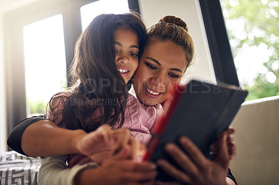 Buy stock photo Relax, home or child with mother or tablet for elearning, playing games or streaming video on movie website. Mom, happy family or girl on technology to download social media for reading ebook online