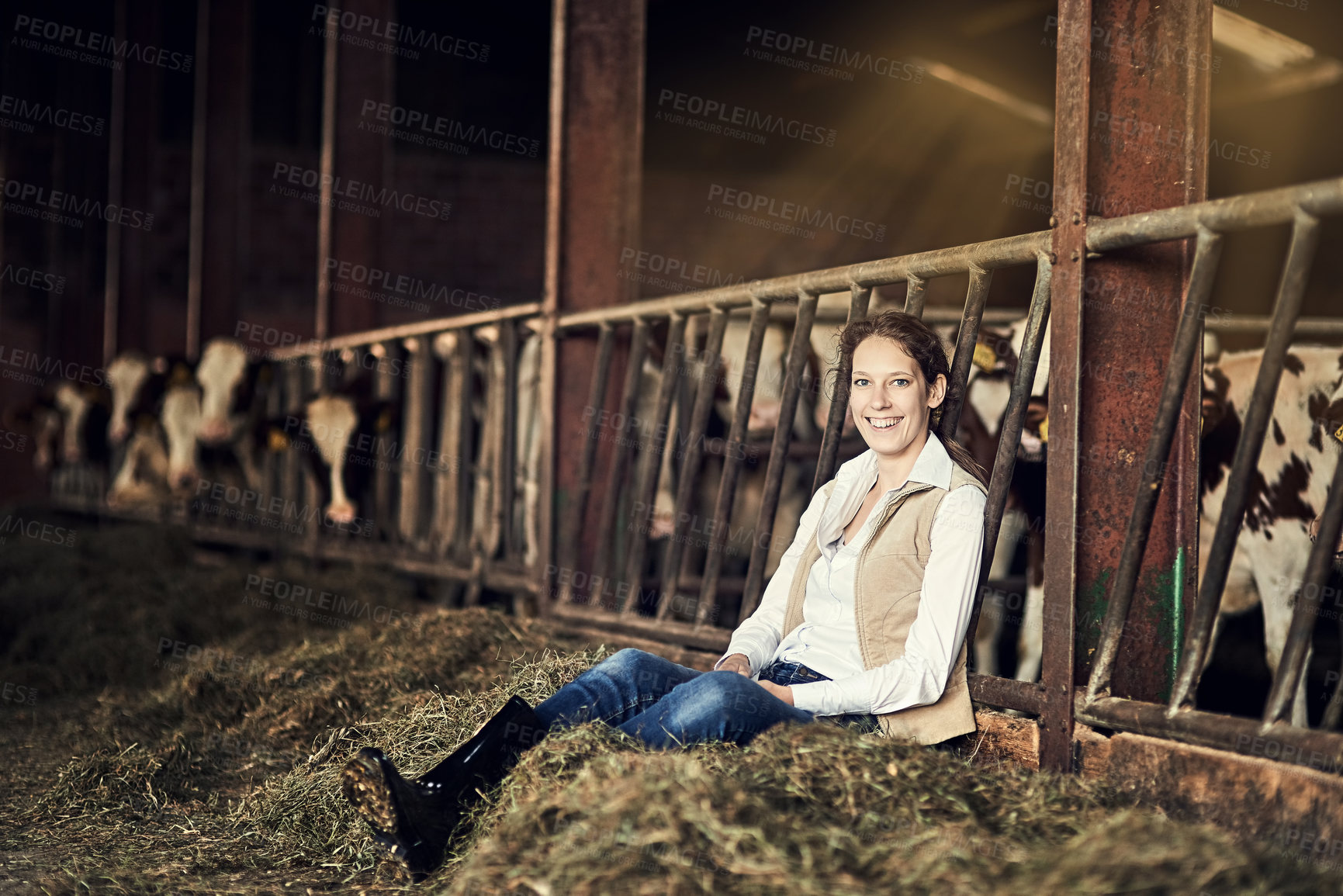 Buy stock photo Women, sitting and portrait in barn for relax at work, rest or break with cattle for agriculture. Female farmer, happiness and stop in stable with dairy animals, happy in countryside with wellness