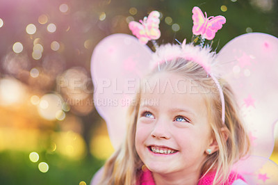 Buy stock photo Happy girl, child and fairy in outdoor park with wings for dress up, princess outfit or cosplay. Bokeh, nature and young kid with smile for fantasy play, childhood or halloween costume in Norway