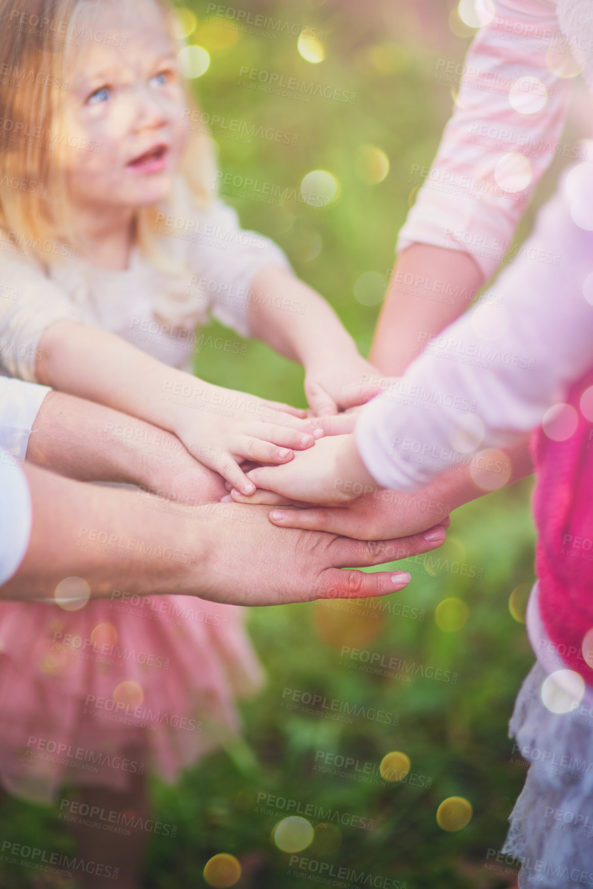 Buy stock photo Kids, family and hands together for team, support and solidarity outdoor on bokeh in summer. Children, huddle and people in nature for community, success or connection for achievement celebration