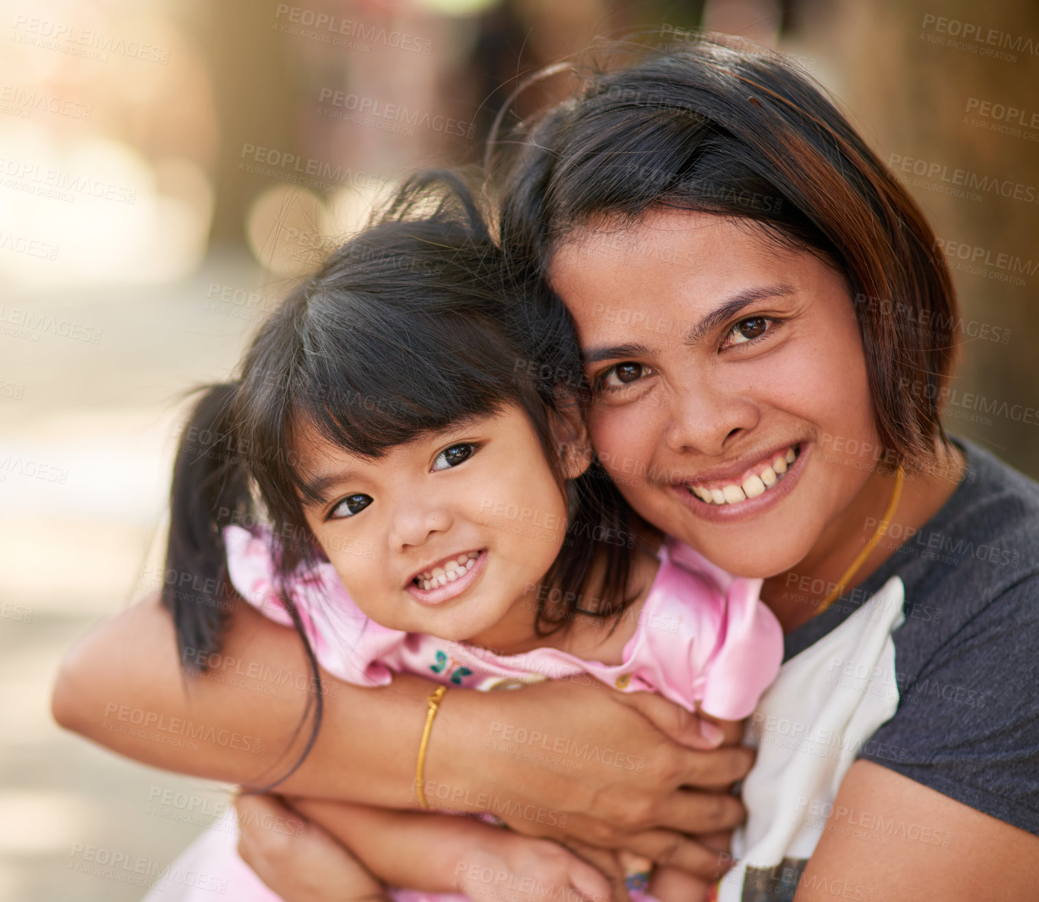 Buy stock photo Portrait of a happy mother and daughter in a loving embrace