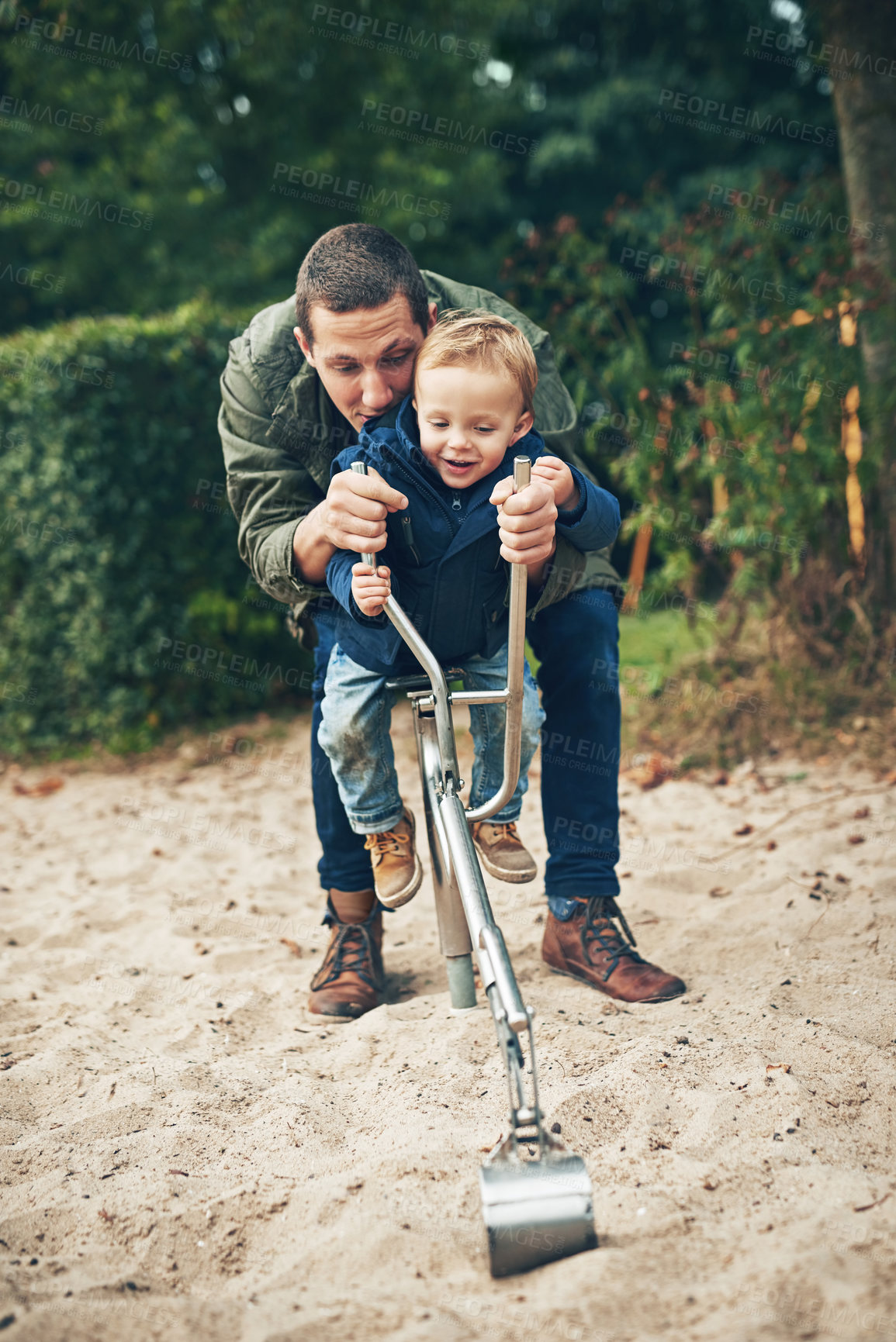 Buy stock photo Dad, boy and happy with excavator toy in park with digging, fun and playing for bonding in Germany. Parent, kid and smile for childhood memories, growth and child development with care and support