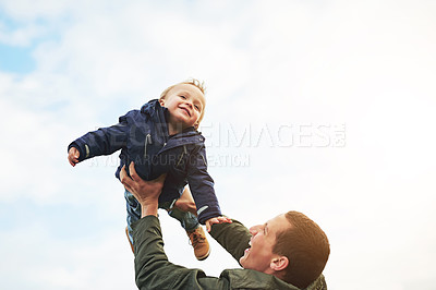 Buy stock photo Father, child and playing together with sky, happy laugh and bonding on outdoor adventure. Dad, son and playful support games in nature for growth, development and fun with energy, smile and care.