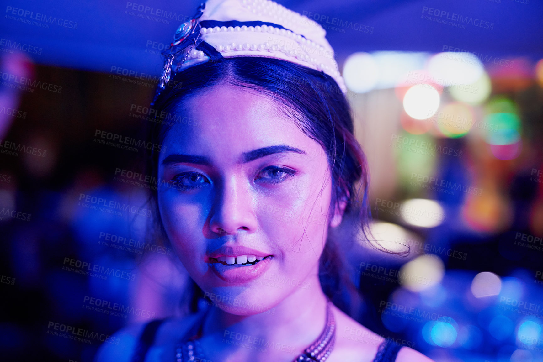 Buy stock photo Portrait of a young woman working in a neon lit Thai nightclub