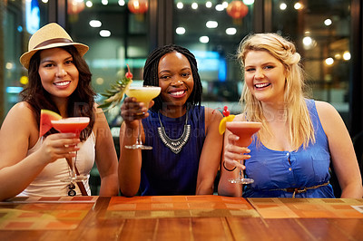 Buy stock photo Cropped portrait of three young girlfriends having drinks at a bar