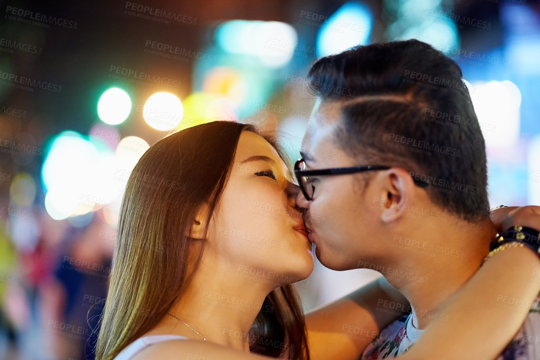 Buy stock photo Asian couple, kiss and city travel for holiday love on marriage honeymoon or sightseeing, street or night. Man, woman and bokeh lights in Thailand for weekend adventure or trip, downtown or romance