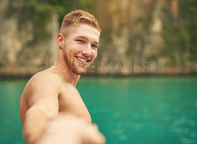 Buy stock photo Cropped portrait of a young man taking a selfie while out for a swim