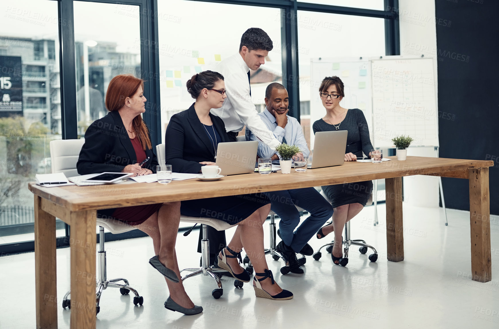 Buy stock photo Teamwork, laptop and training with business people in meeting for partnership, data analytics and company revenue. Client feedback, admin stats and mentor with employees in office for research