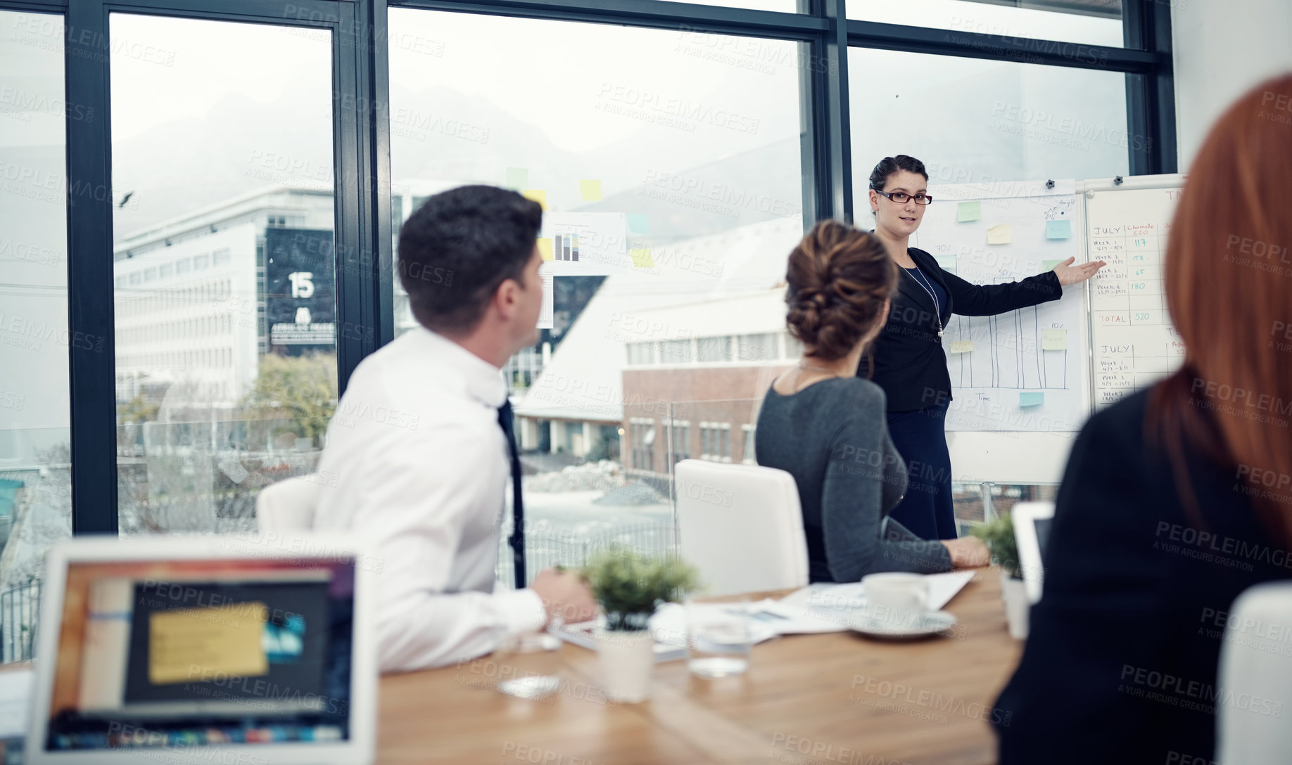 Buy stock photo Business, woman or pointing to presentation in finance meeting for sales target review or company stats feedback. Growth chart, financial manager or people in workshop for workflow strategy in office