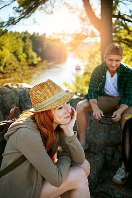 Buy stock photo Shot of two young people hiking while on an overseas trip