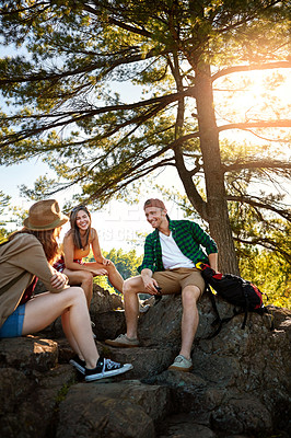 Buy stock photo Shot of three young people hiking while on an overseas trip