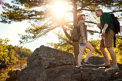 Buy stock photo Nature, hiking and happy couple walking with conversation, trees and adventure holiday in mountain. Trekking, man and woman on travel vacation together in forest park with chat, rocks and outdoor fun