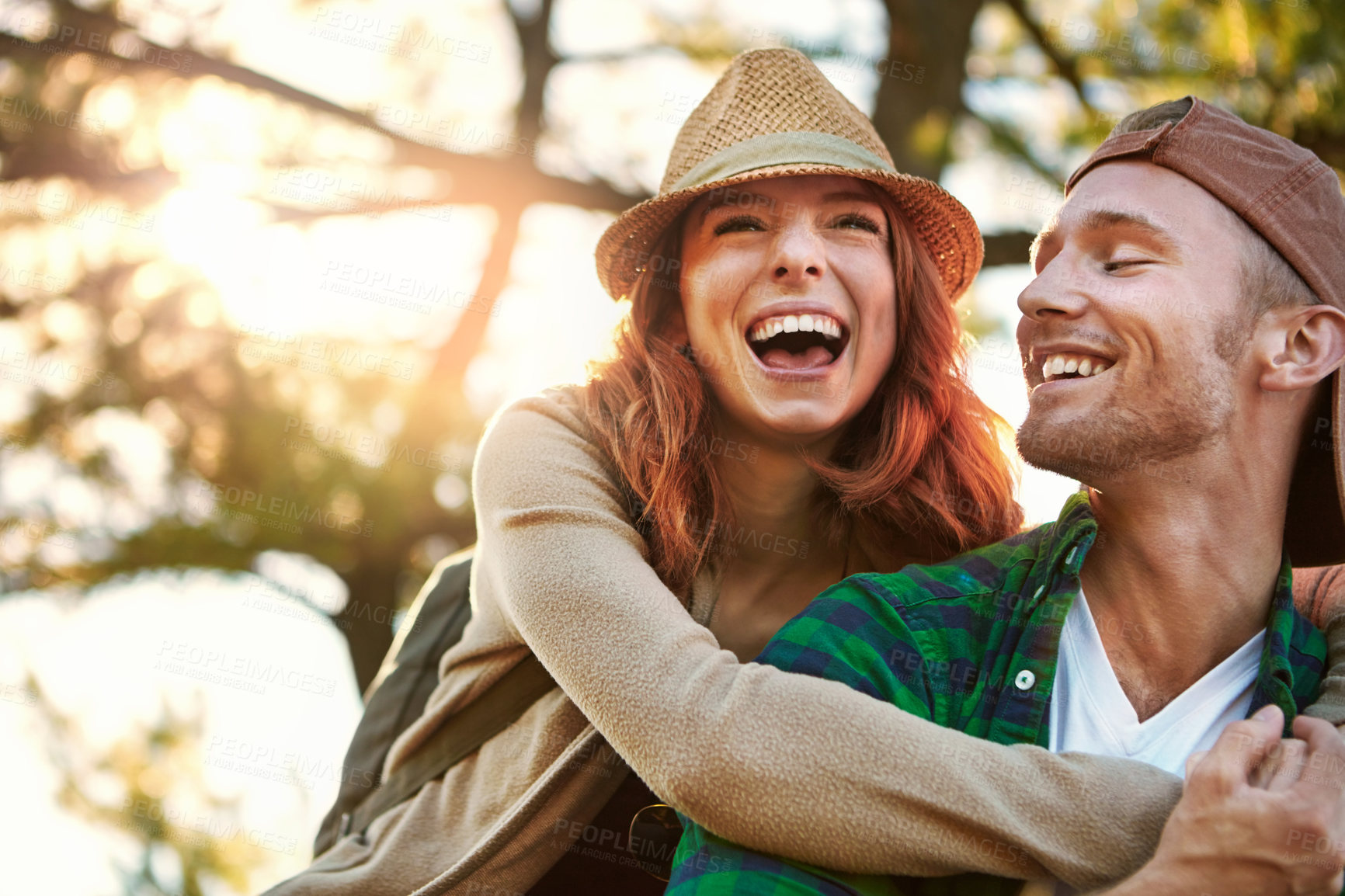 Buy stock photo Shot of an affectionate young couple hiking while on an overseas trip