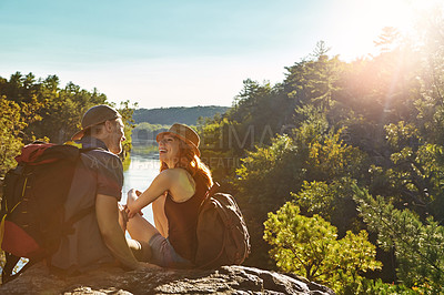 Buy stock photo Shot of an affectionate young couple hiking while on an overseas trip