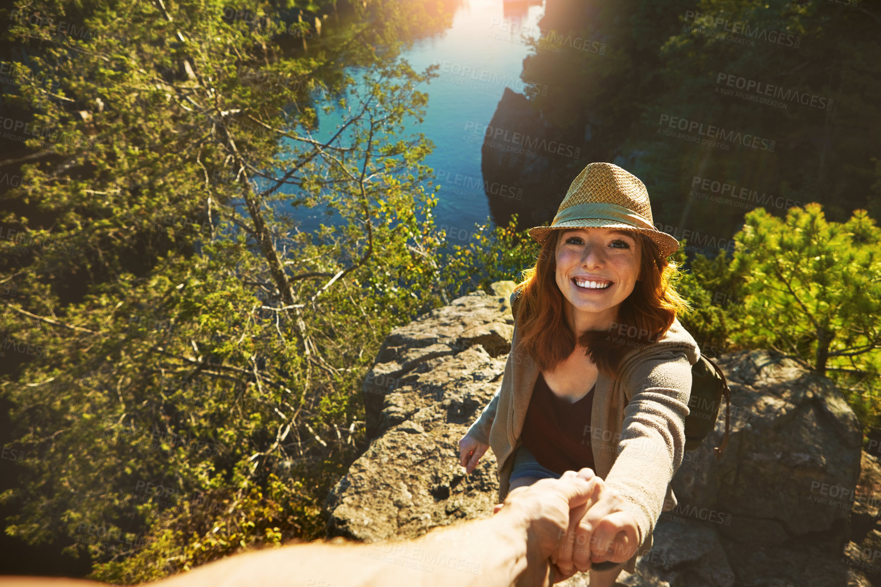 Buy stock photo Shot of a young couple out on an adventurous date in the mountains