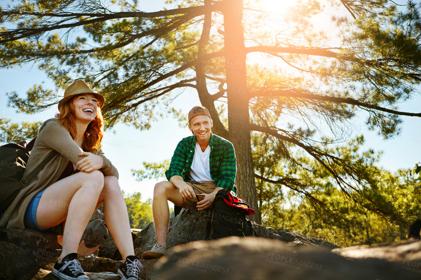 Buy stock photo Shot of two young people hiking while on an overseas trip