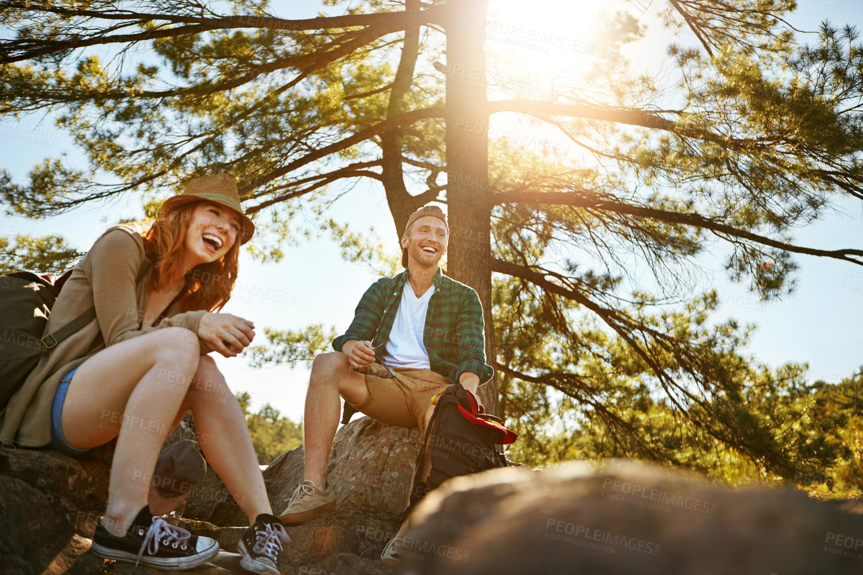 Buy stock photo Shot of two young people hiking while on an overseas trip