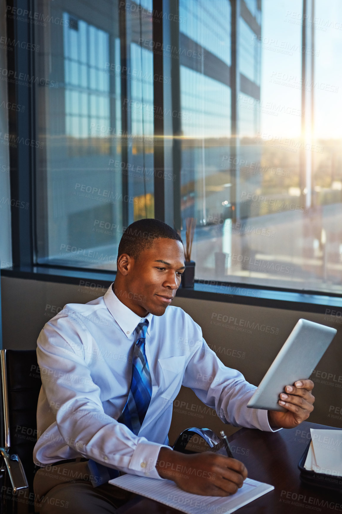 Buy stock photo Businessman, writing and book with tablet for finance, legal paperwork or budget planning at office. Black man, financial advisor or accountant taking notes with technology for tasks, report or audit