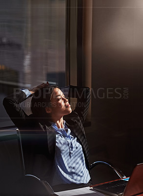 Buy stock photo Cropped shot of a businesswoman sitting thoughtfully in her office