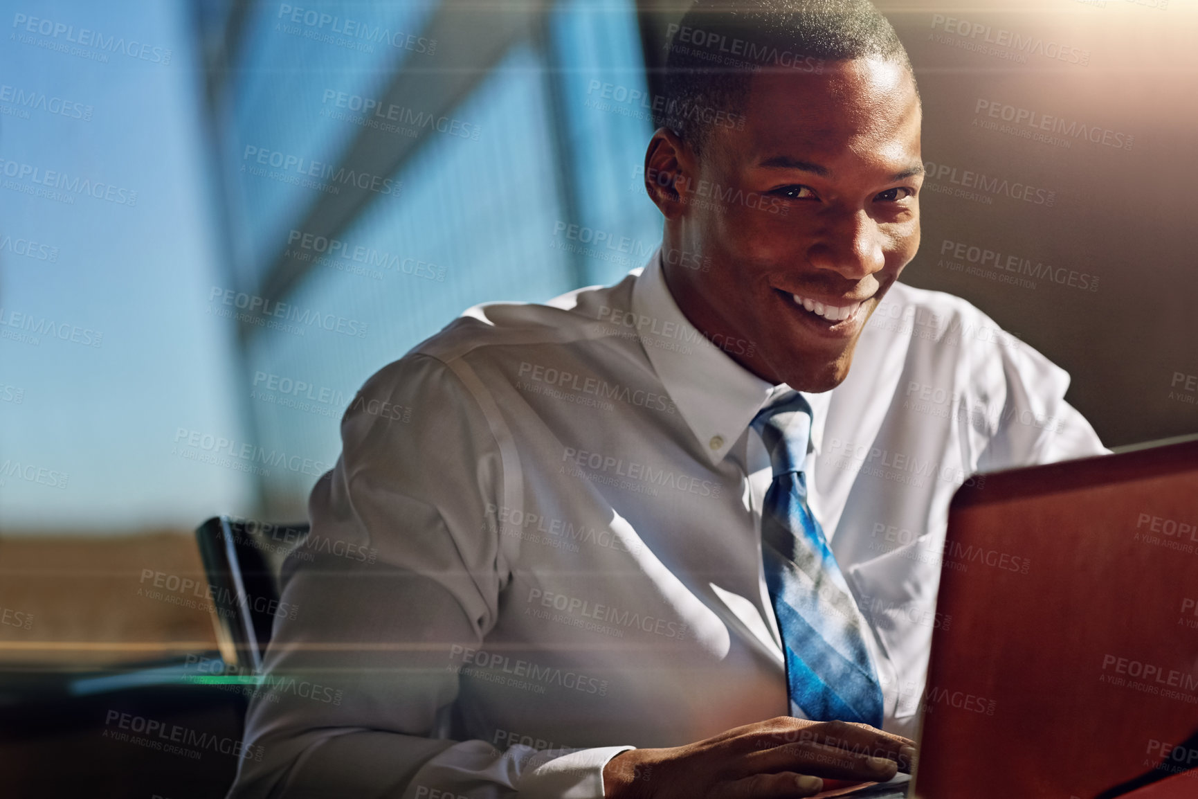 Buy stock photo Shot of a businessman using his laptop at his desk