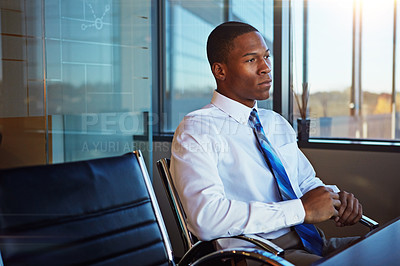 Buy stock photo Cropped shot of a businessman sitting thoughtfully in his office